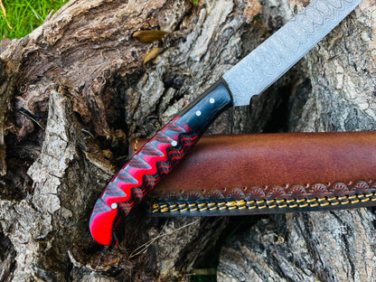 Damascus steel flay knife with craved blue-black grip and rivets, leather sheath on Tampa Home & Garden Store