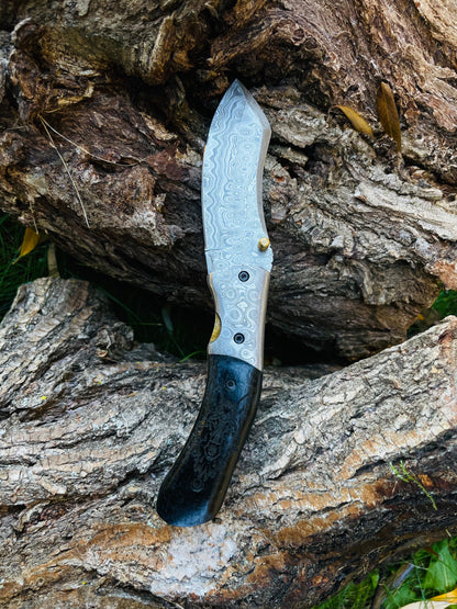 Damascus steel folding knife Wolf Engraved TF-084, patterned blade, brass accent, black handle on Tampa Home & Garden Store