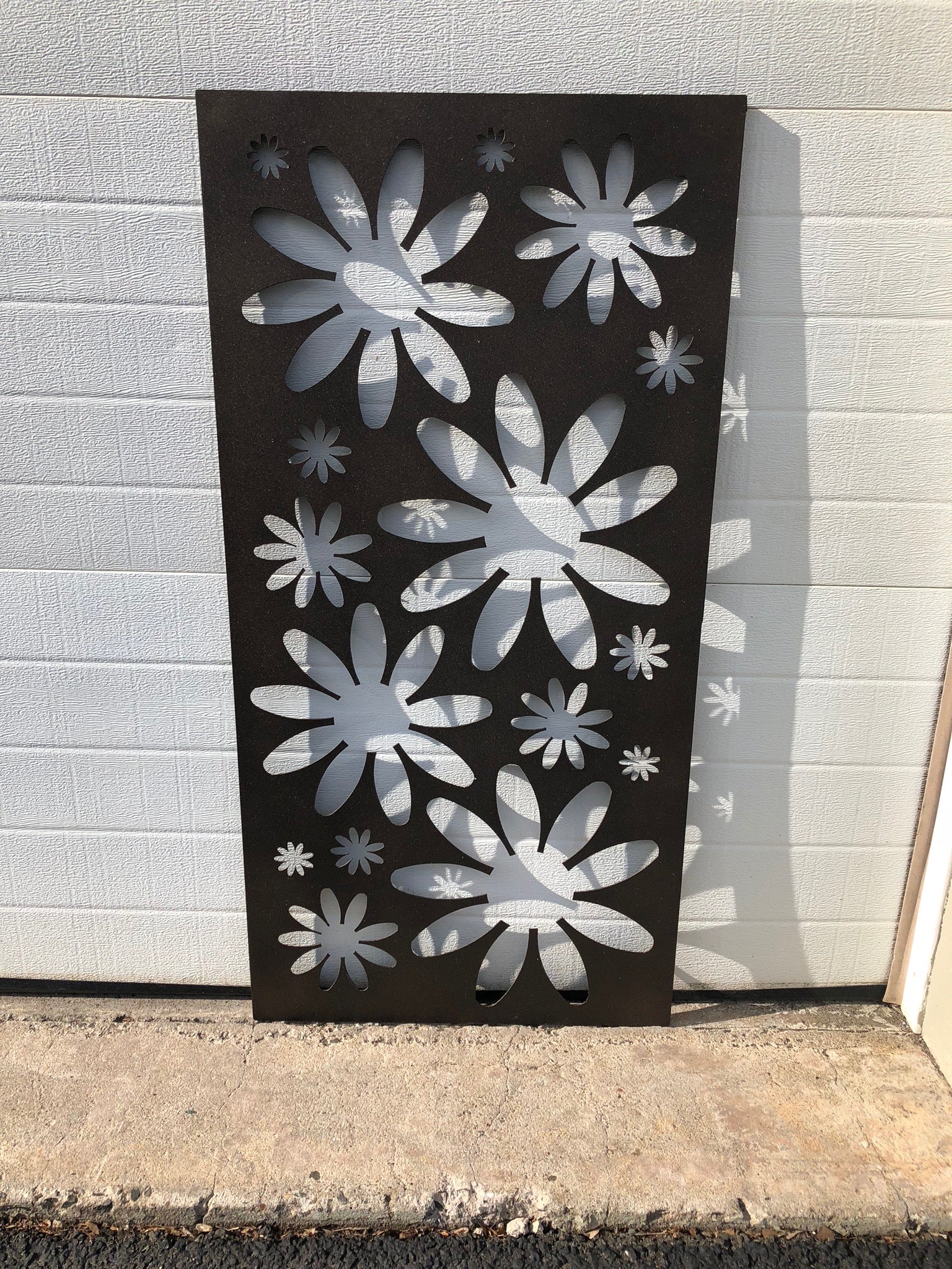 Rustica Ornamentals outdoor metal privacy panel with daisy cutouts in black heavy-duty steel on Tampa Home & Garden Store