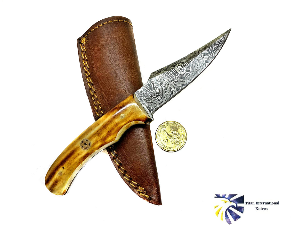 Damascus skinning knife with burnt bone handle in leather sheath by Titan Knives on Tampa Home & Garden Store