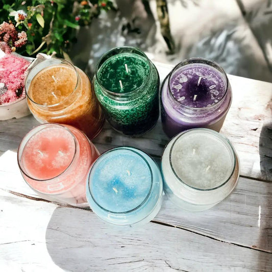 Gia Roma XL Candles 24oz assorted color jars, 6 glass candles on a rustic wood table on Tampa Home & Garden Store