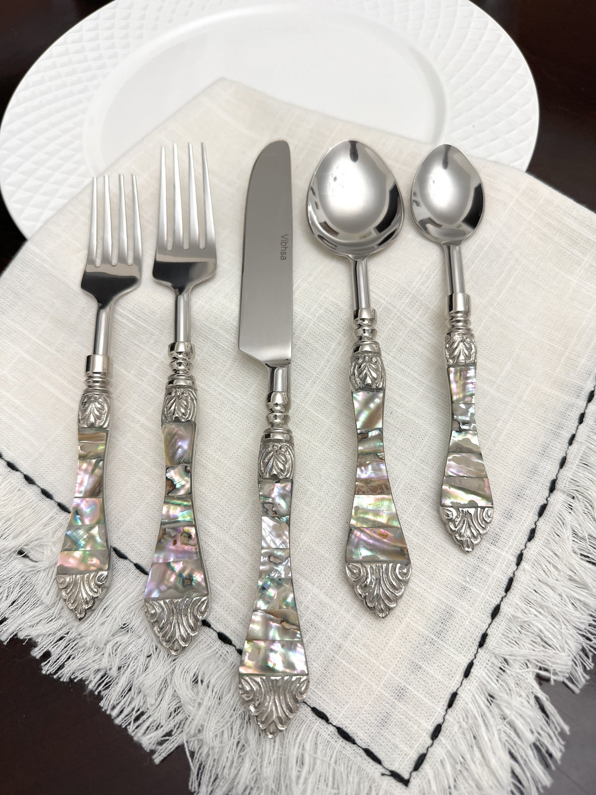 Vibhsa flatware set of 20 with Seawork handles, forks, knives and spoons on a napkin on Tampa Home & Garden Store