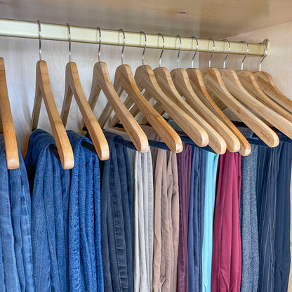 Horderly Bamboo Hangers with Velvet Bar, natural wood finish with metal hooks on a closet rod on Tampa Home & Garden Store