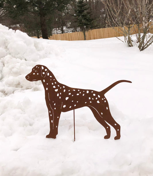 Dalmatian garden stake silhouette in rust metal with white spots, standing in snow on Tampa Home & Garden Store