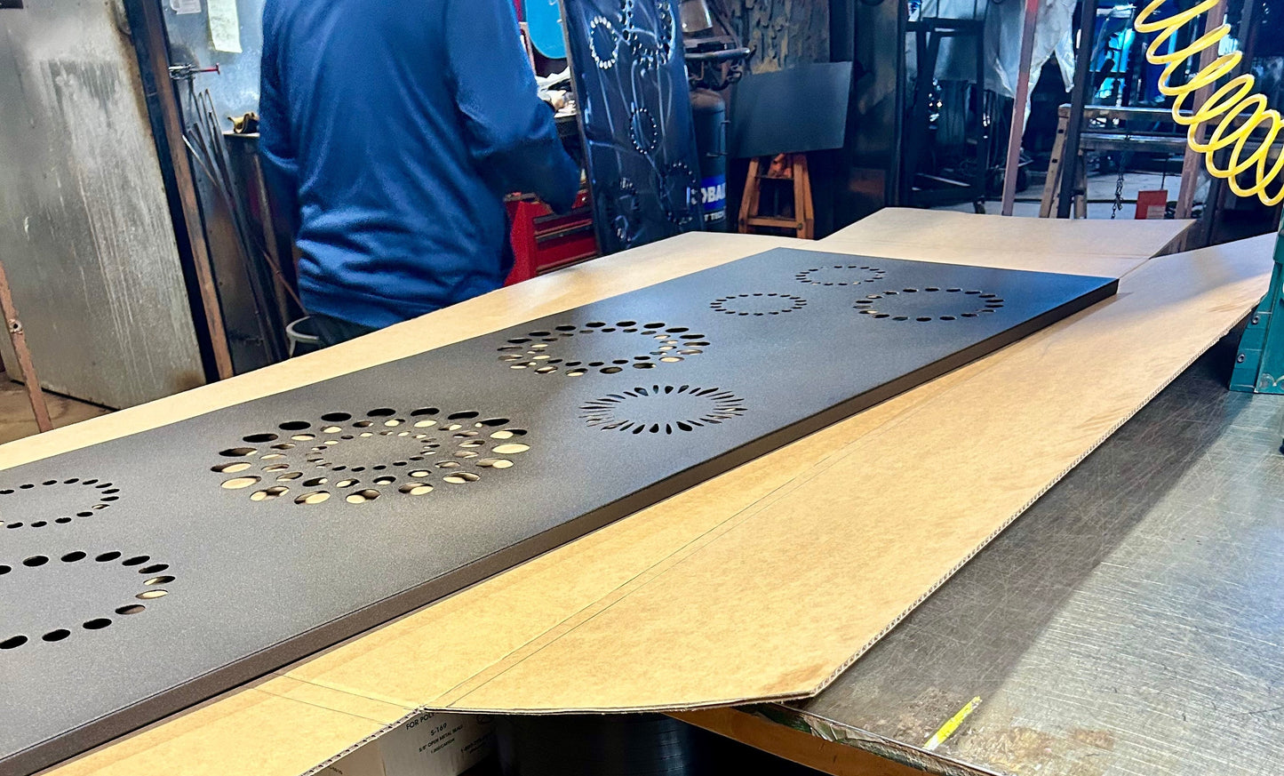 46-inch decorative privacy panel in dark gray metal with circular perforation patterns on Tampa Home & Garden Store