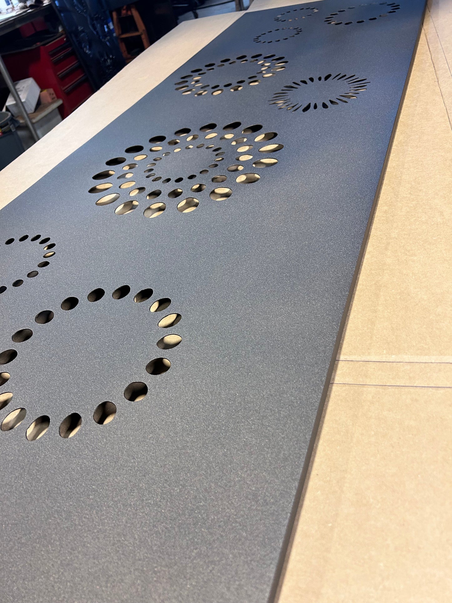 Metal screen panel Rustica Ornamentals, dark gray perforated privacy panel with circular cutouts on Tampa Home & Garden Store