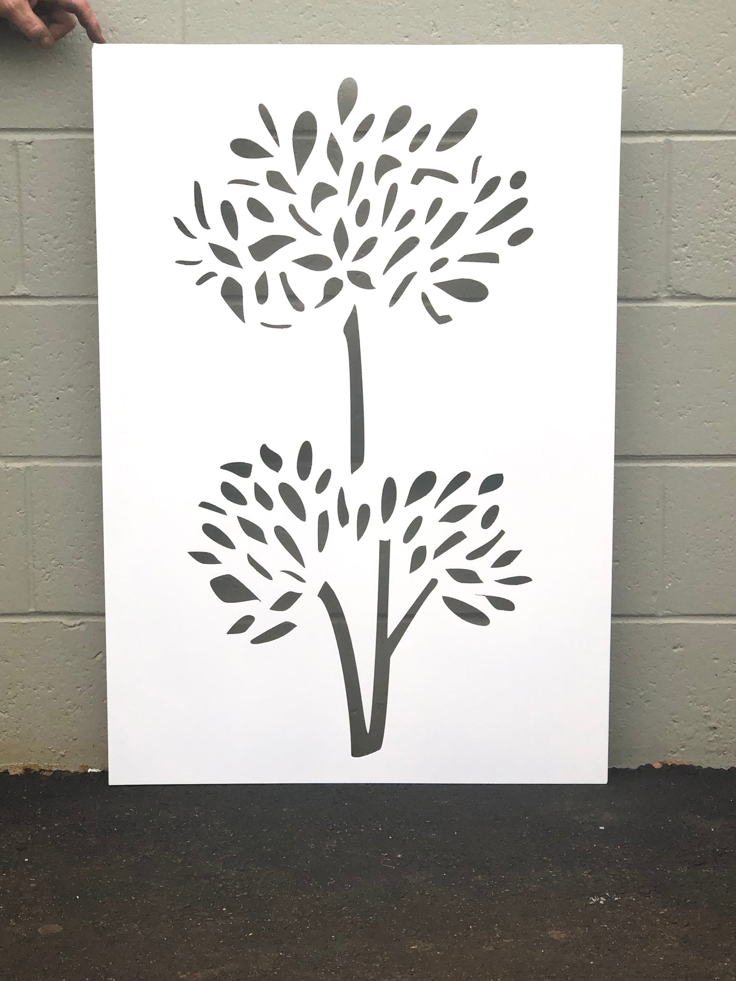 Outdoor privacy screen panel with dark gray tree silhouette on white bg Rustica Ornamentals on Tampa Home & Garden Store