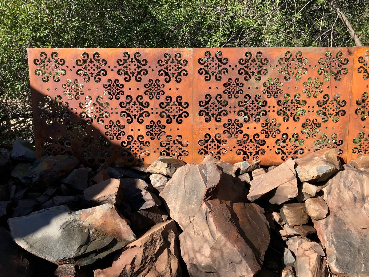 Outdoor metal privacy panels, rusted steel with ornate cutouts, two-panel set on Tampa Home & Garden Store
