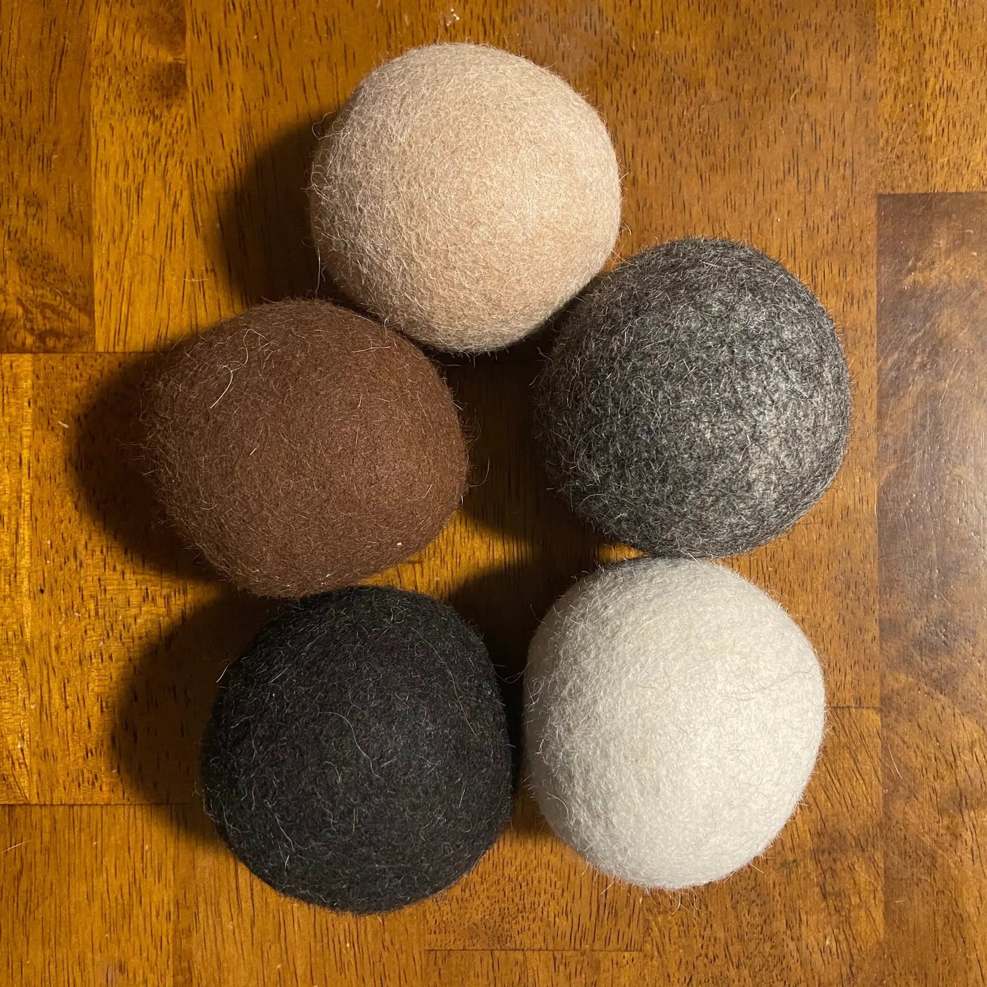 Green Llama locally sourced alpaca wool dryer balls in assorted brown gray beige colors on Tampa Home & Garden Store