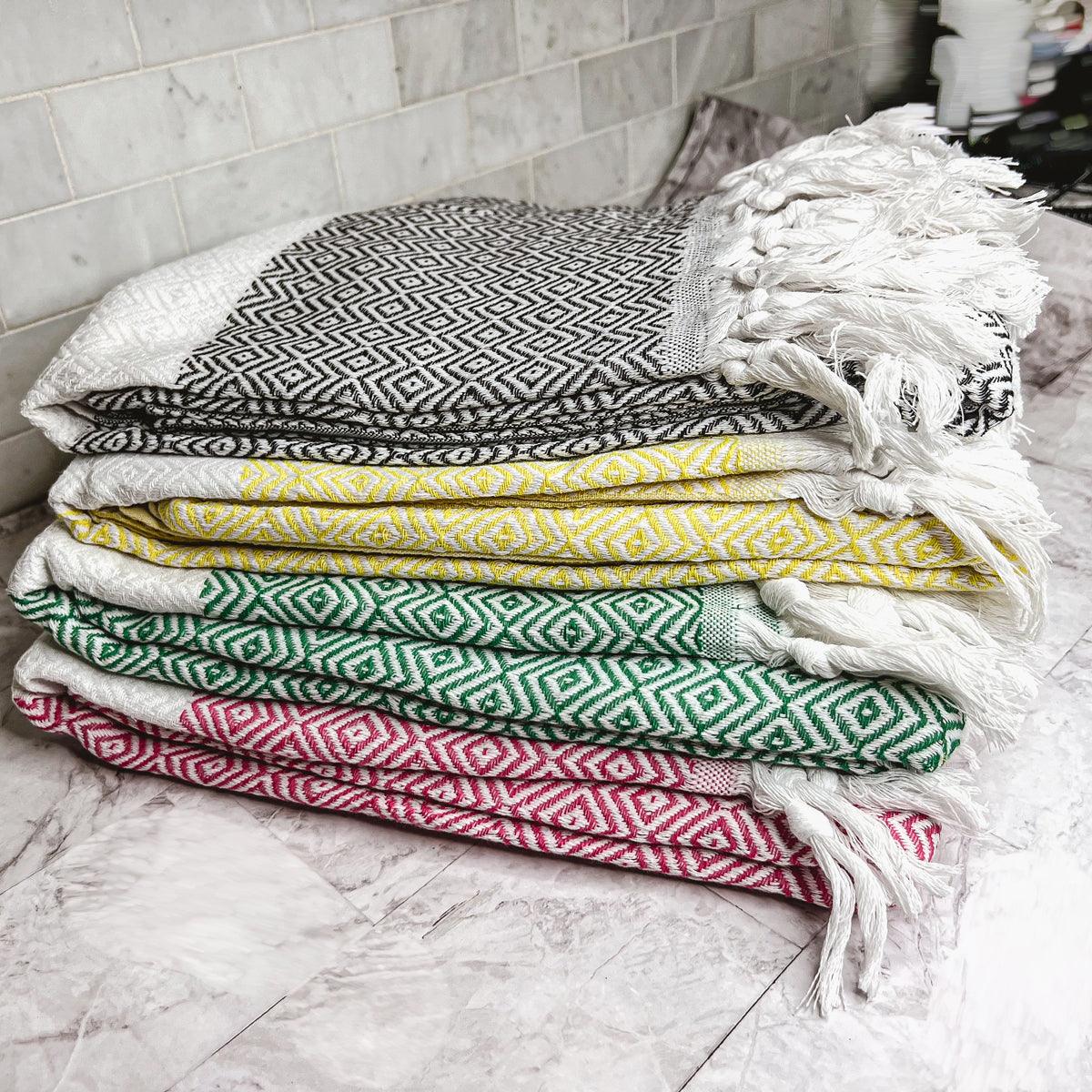 Haley Diamond Towel 200GSM beach towels in black/white geometric pattern with tassels by Gia Roma on Tampa Home & Garden Store