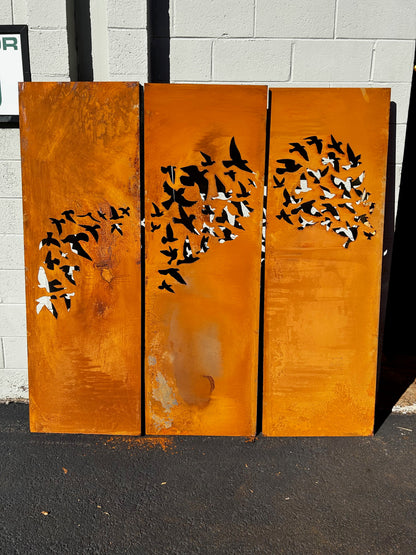 Outdoor metal privacy fence panels in rust-orange with bird silhouettes, 3-panel set on Tampa Home & Garden Store
