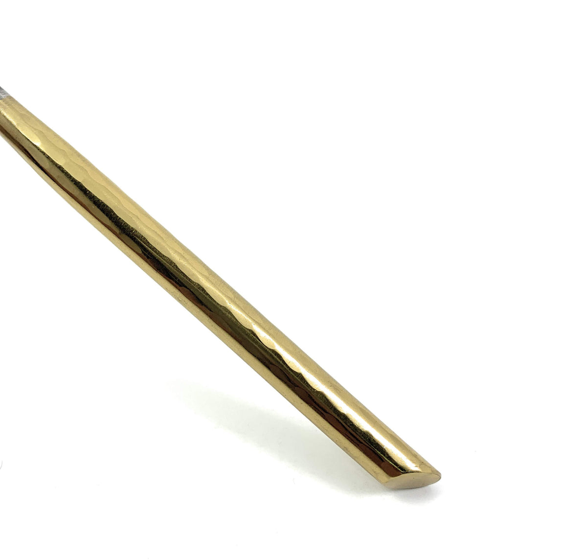 Vibhsa gold-toned flatware handle close-up with subtle hammered texture on Tampa Home & Garden Store