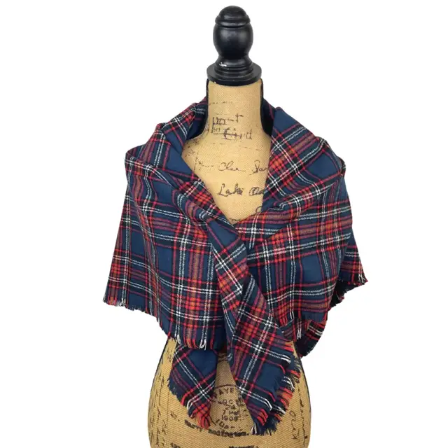 Tartan scarf by Thistle & Stitch in navy red with mustard accents, fringed ends on a dress form on Tampa Home & Garden Store