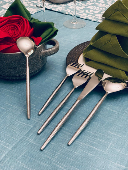 Vibhsa hammered silver flatware set of 20 with hammered handles, spoons and forks on teal table on Tampa Home & Garden Store
