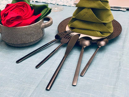 Vibhsa black stainless steel 20 pc flatware set with red rose centerpiece on table on Tampa Home & Garden Store
