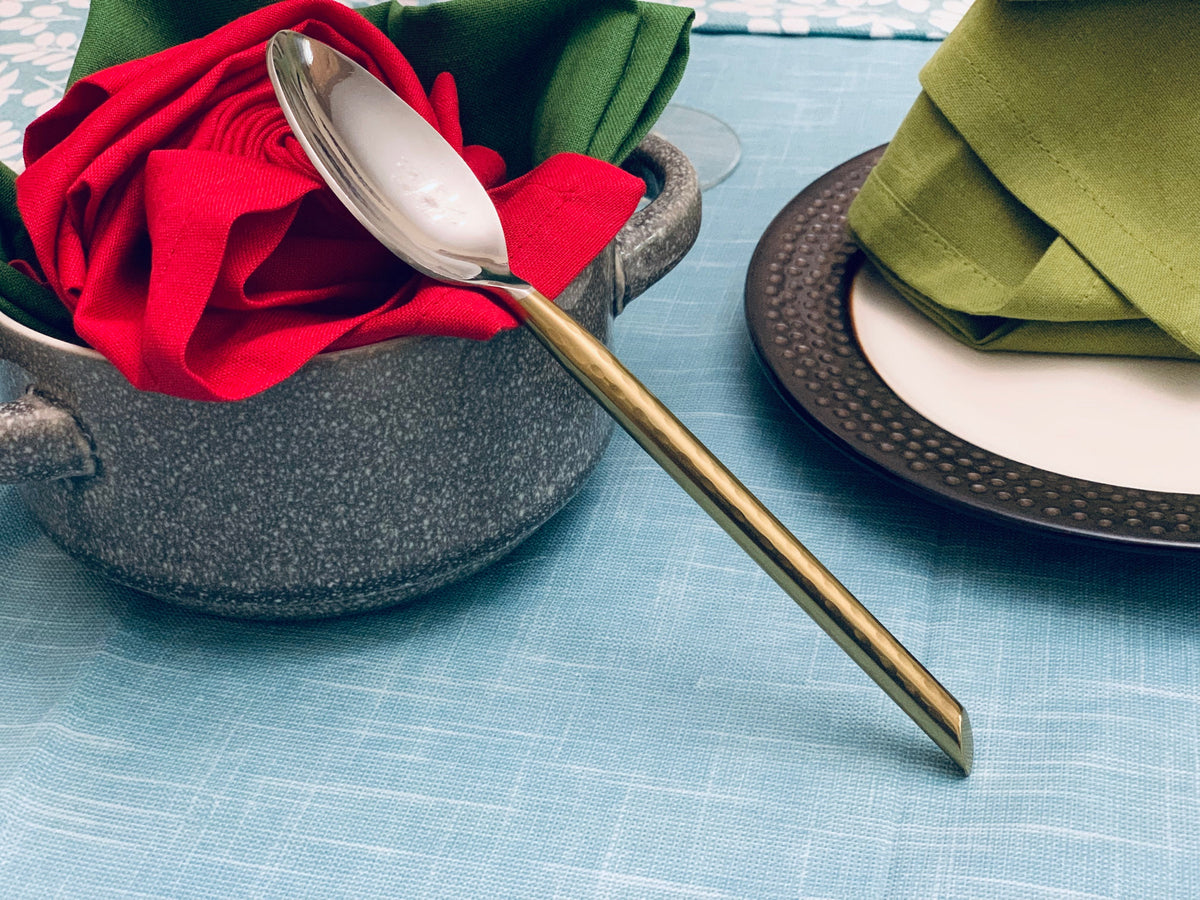 Vibhsa golden silverware flatware set 30 pieces with gold-tone spoon atop a red napkin on Tampa Home & Garden Store