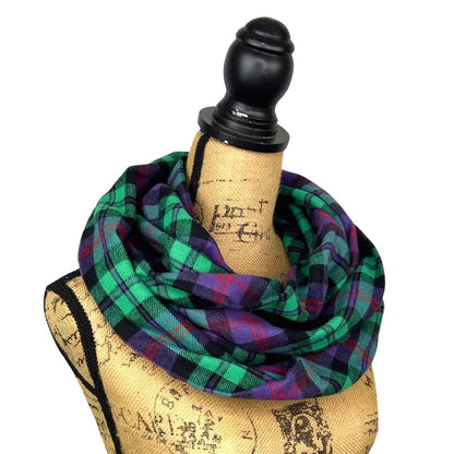 Plaid flannel infinity scarf in spearmint green, purple, red and black wrapped on a mannequin on Tampa Home & Garden Store