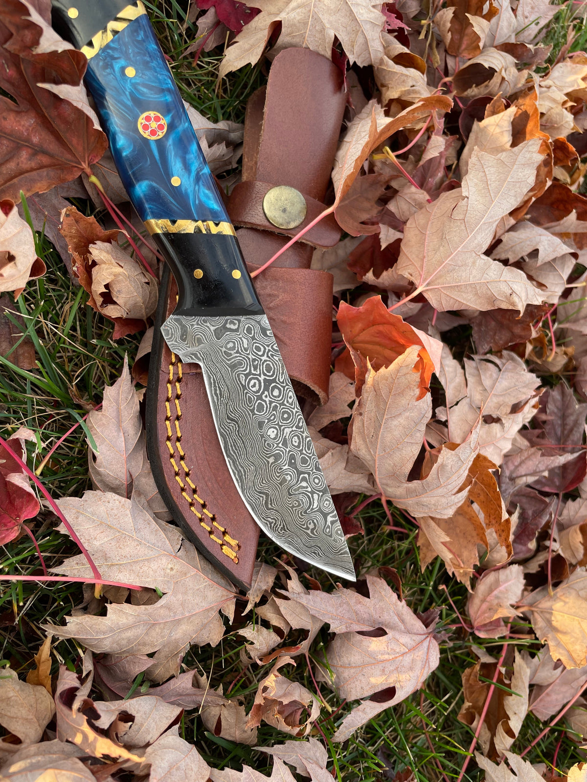 Phantom TK-213 Damascus knife by Titan K with marbled handle and brass pins in leather sheath on Tampa Home & Garden Store