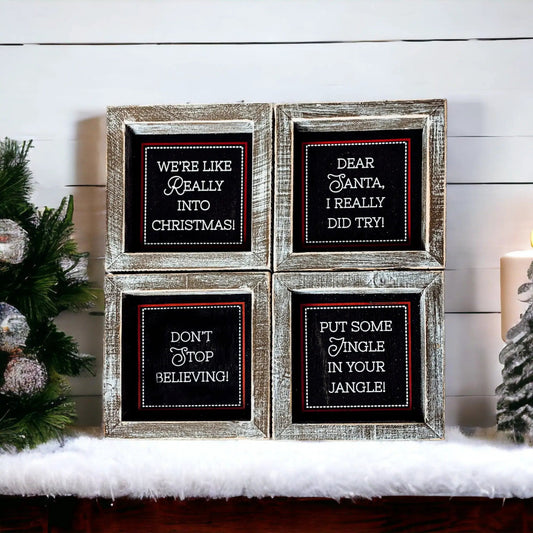 Black Christmas sign pair by Gia Roma in distressed wood frames with white chalkboard text on Tampa Home & Garden Store