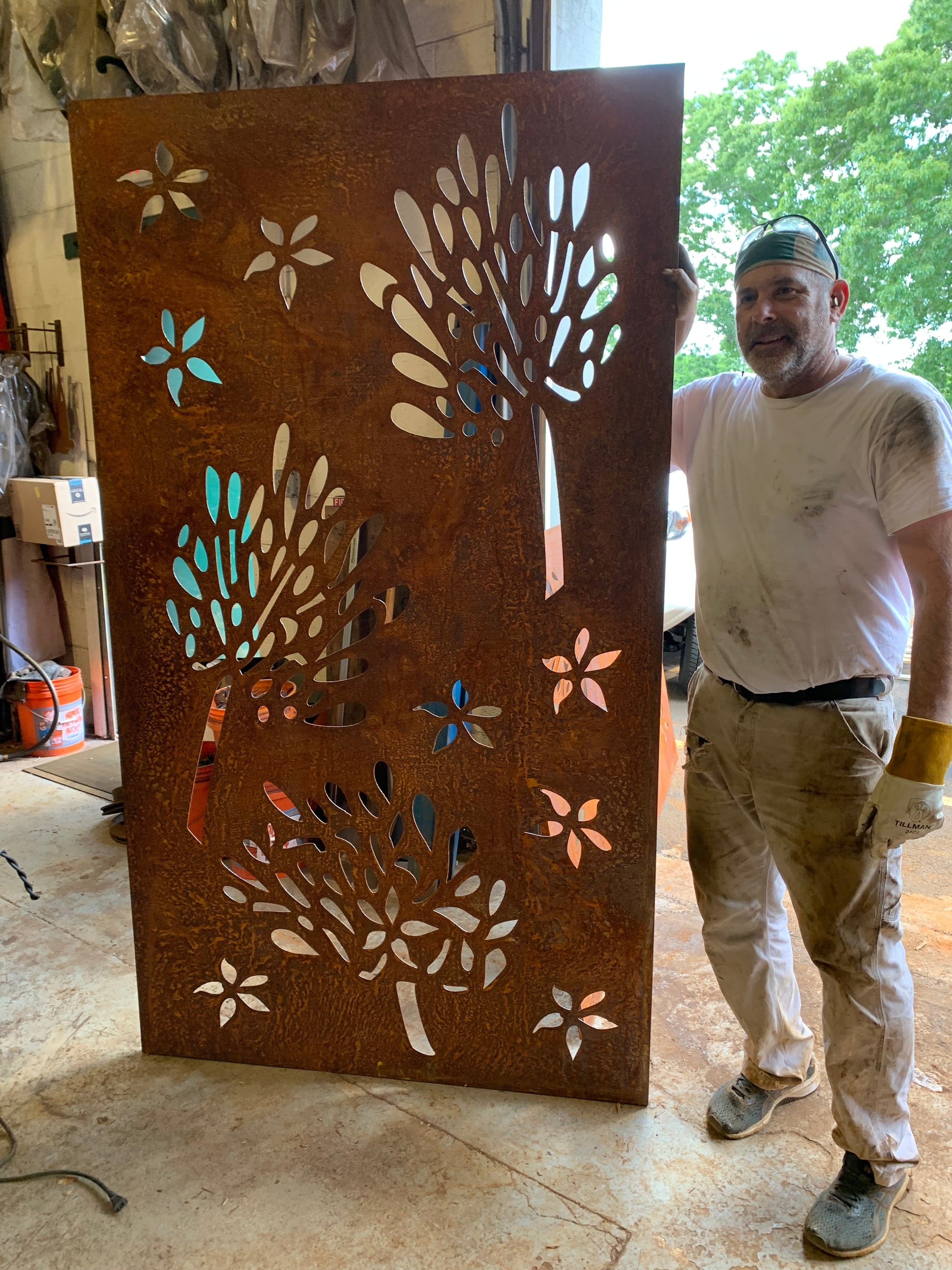 Rust metal privacy screen with leaf-cutout design, 46 in outdoor wall art on Tampa Home & Garden Store
