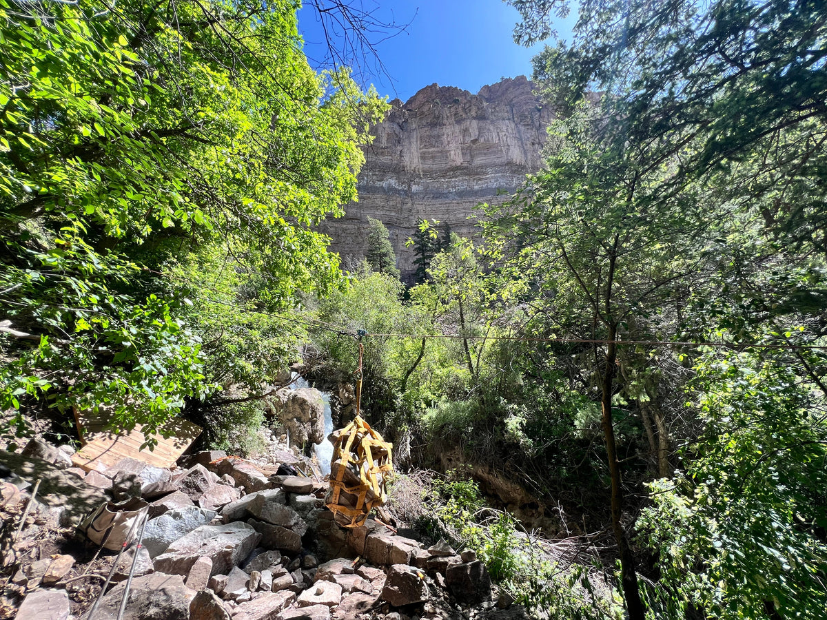Rock Hammock by Backslope Tools, yellow gear bag and rope on rocky canyon terrain on Tampa Home & Garden Store