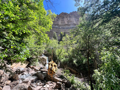 Rock Hammock by Backslope Tools, yellow gear bag and rope on rocky canyon terrain on Tampa Home & Garden Store