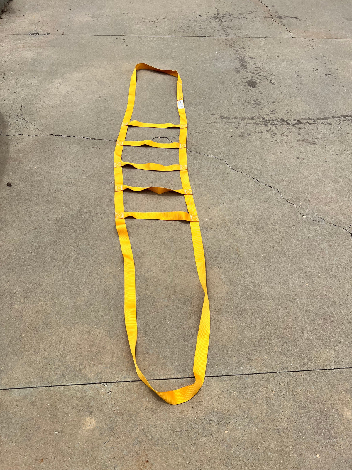 Rock Belt yellow nylon ladder strap by Backslope Tools for rugged jobsite use on Tampa Home & Garden Store