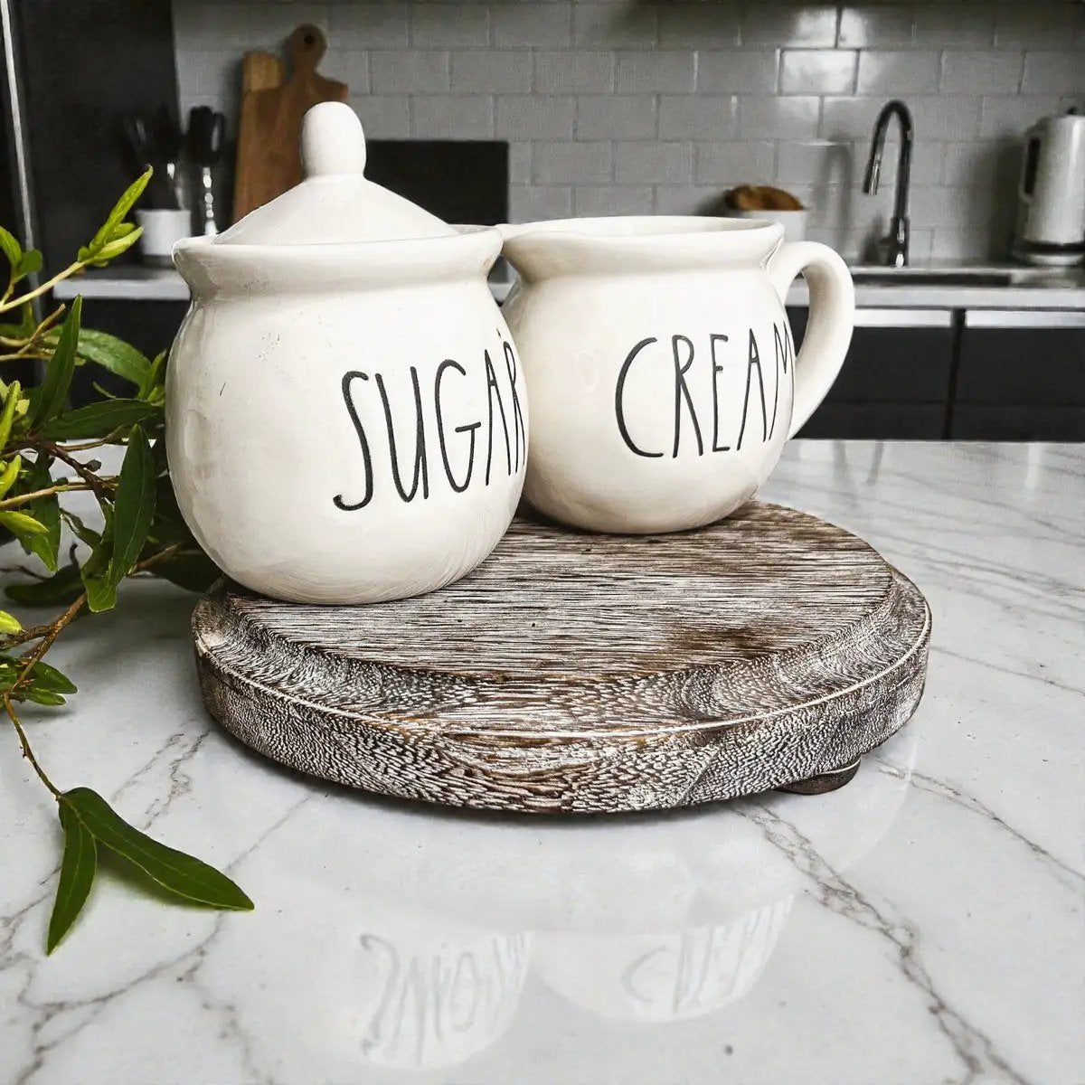Rustic round wood pedestal tray with white ceramic sugar and cream jars on Tampa Home & Garden Store