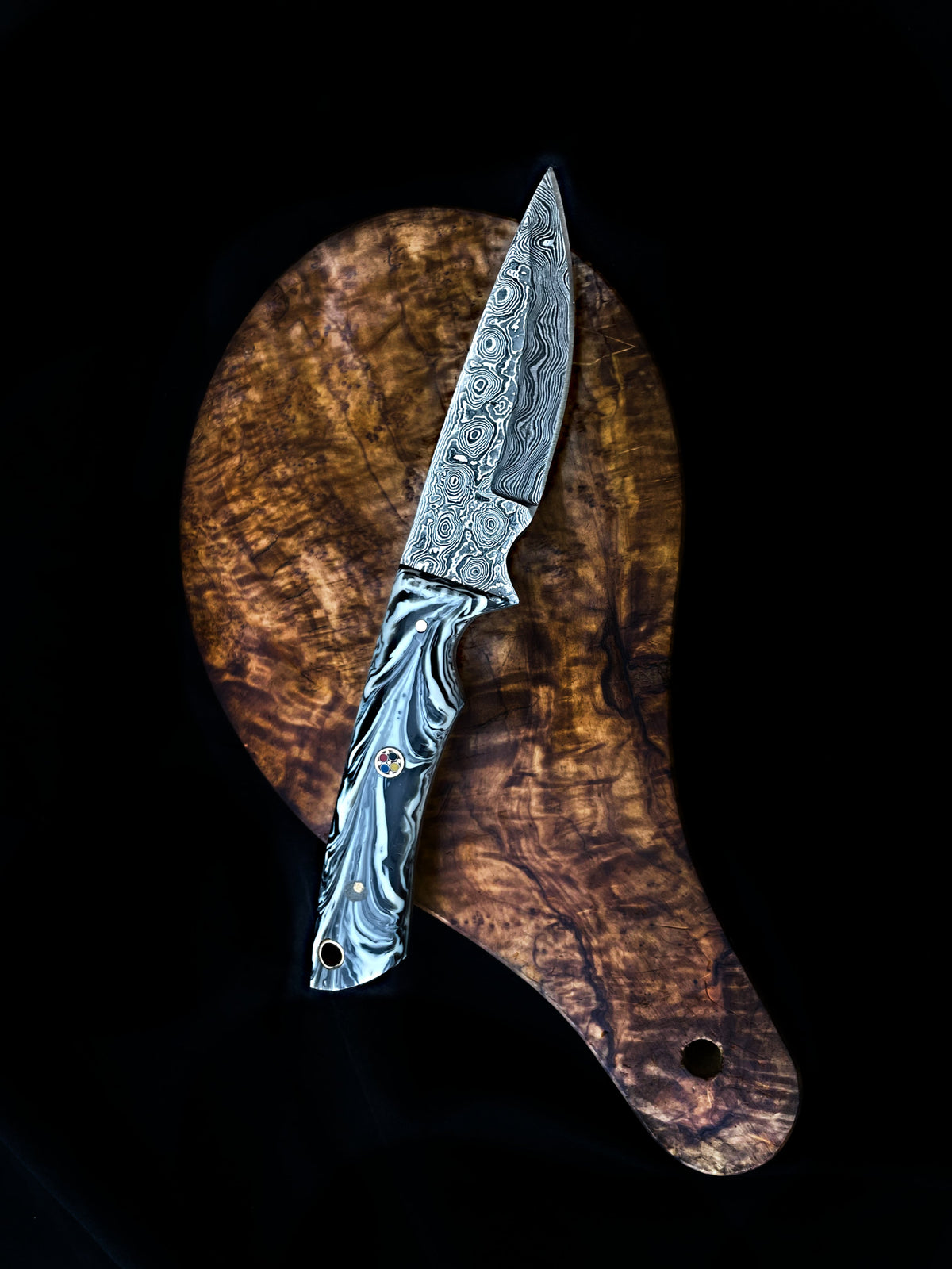 Arrival TD-705 hunting knife with Damascus blade and marbled handle on round wood board on Tampa Home & Garden Store