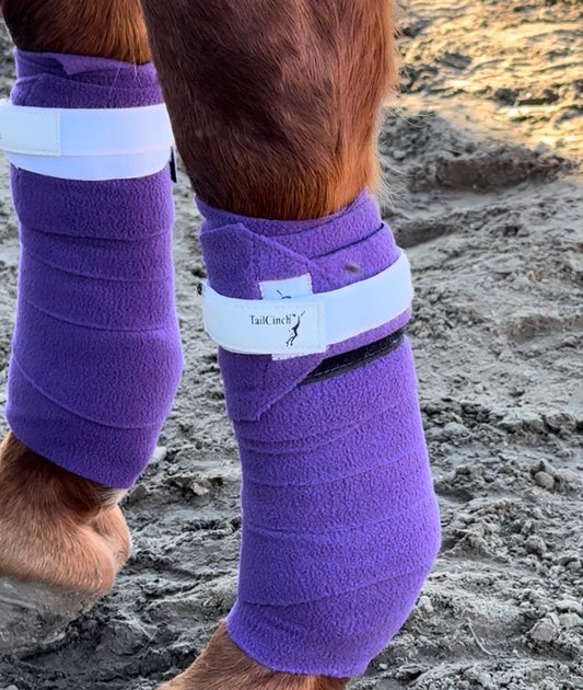 Purple fleece PoloCinch Polo Wrap Guards pair with white TailCinch Velcro strap on horse legs on Tampa Home & Garden Store