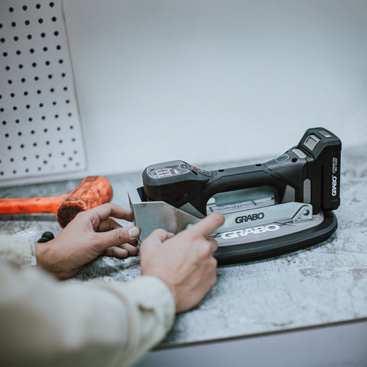 GRABO Impact Plate Hammer Shield with gray metal shield on cordless tool; GRIP TECH TOOLS on Tampa Home & Garden Store