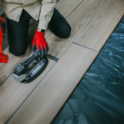 GRABO Impact Plate Hammer Shield suction grip tool accessory in use on wood with red gloves on Tampa Home & Garden Store