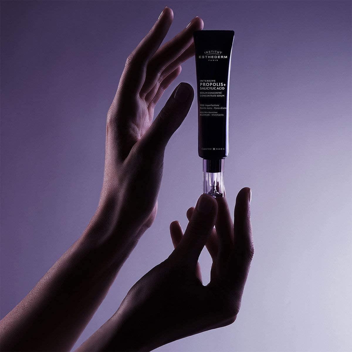 Face serum Esthederm Intensive Propolis + Salicylic Acid, black tube in hand under light on Tampa Home & Garden Store