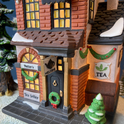Illuminated Christmas Village Tea Seller House by Dept 56. Christmas in the City. Magical Holiday Home Retail Decor. Gift for Tea Lover. - Tampa Home & Garden Store