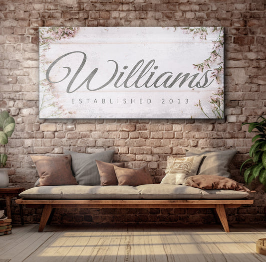 Family Name Sign canvas with gray script on light background and floral accents established 2013 on Tampa Home & Garden Store