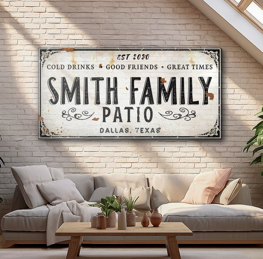 Family Patio Sign canvas by Tailored Canvases with vintage white and bold black lettering on brick wall on Tampa Home & Garden Store