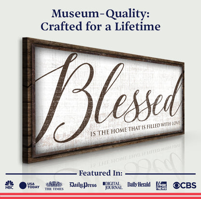 Wood-framed canvas sign Blessed Is The Home That Is Filled With Love, script lettering on Tampa Home & Garden Store