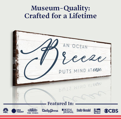 Canvas sign An Ocean Breeze Puts A Mind At Ease by Tailored Canvases, crafting canvas with distressed white wood and blue script on Tampa Home & Garden Store