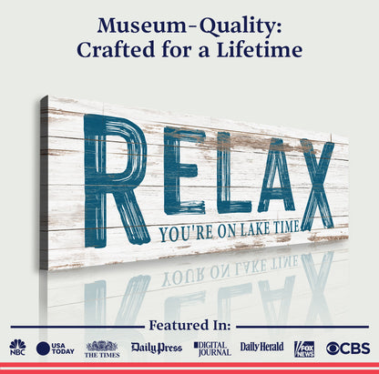 Relax You're on Lake Time sign canvas by Tailored Canvases with wood backdrop and blue lettering on Tampa Home & Garden Store
