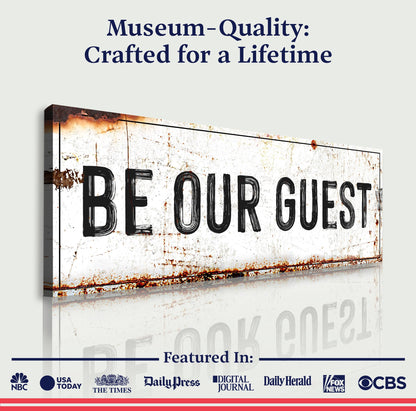 Be Our Guest Sign V canvas with distressed white panel and bold black lettering on Tampa Home & Garden Store