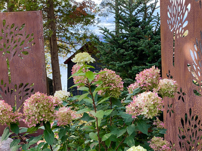 Privacy screens metal wall art by Rustica Ornamentals, rust panels with leaf motifs, pair on Tampa Home & Garden Store