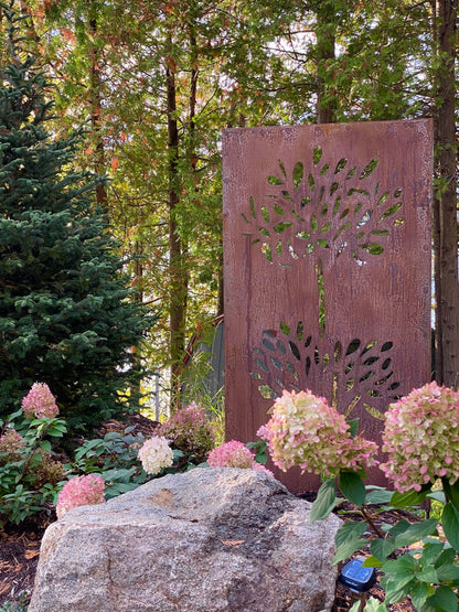 Outdoor rust-colored metal privacy screen panel with leaf-cutout motif by Rustica Ornamentals on Tampa Home & Garden Store