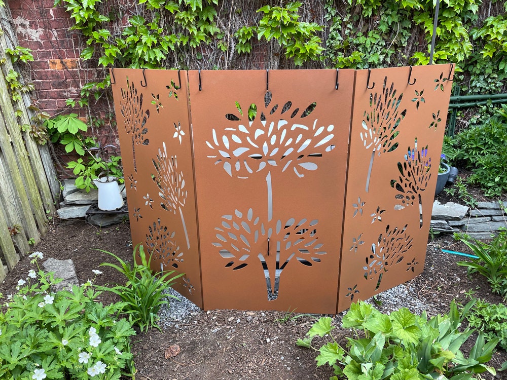 Outdoor three-panel rust-colored privacy screen with tree cutouts by Rustica Ornamentals on Tampa Home & Garden Store