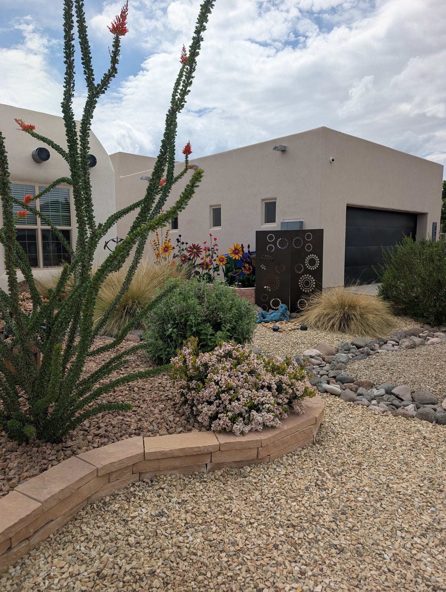Decorative metal privacy panels 46 inch with circular cutouts in desert garden on Tampa Home & Garden Store