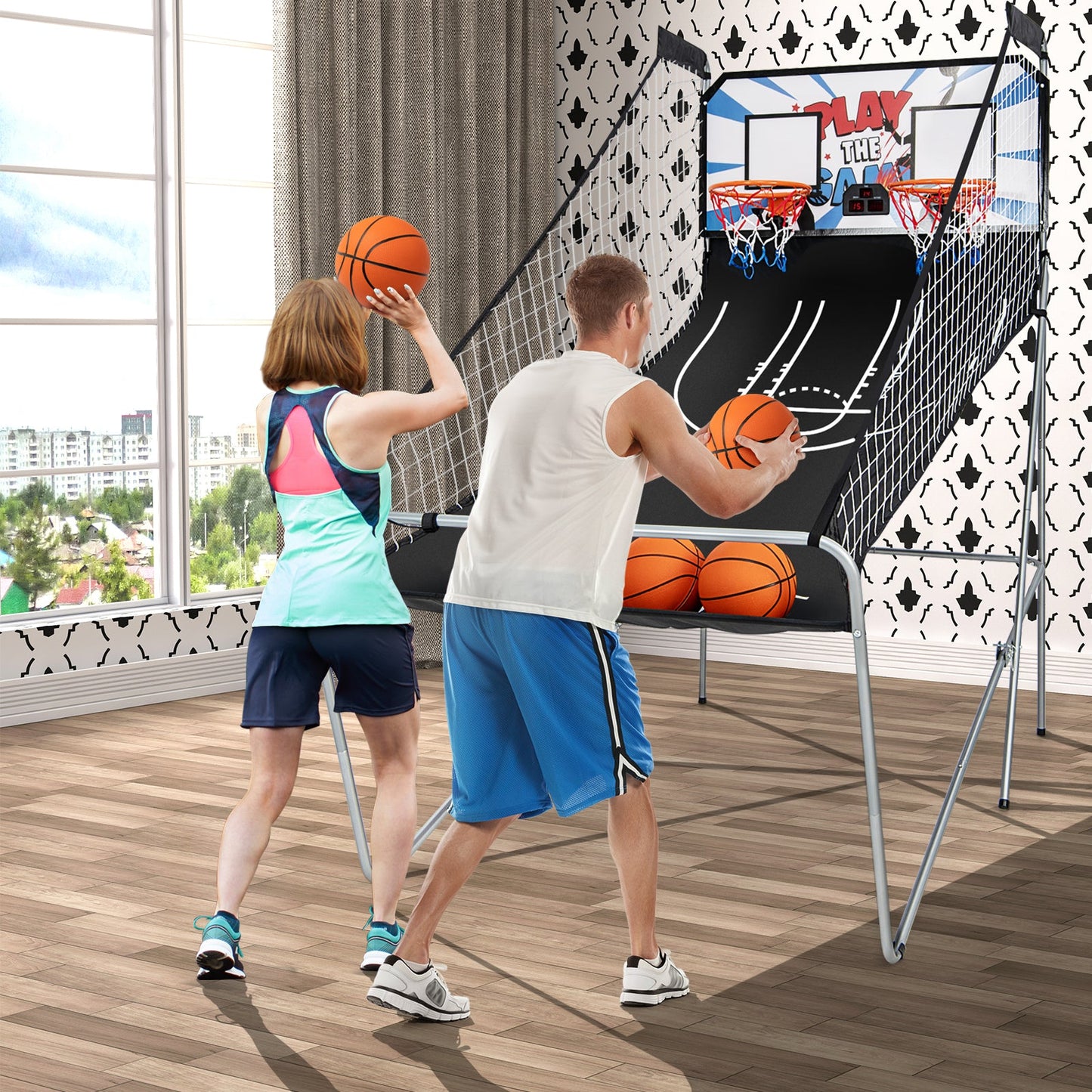 Basketball arcade game with dual hoops and a backboard; players shoot orange balls indoors on Tampa Home & Garden Store
