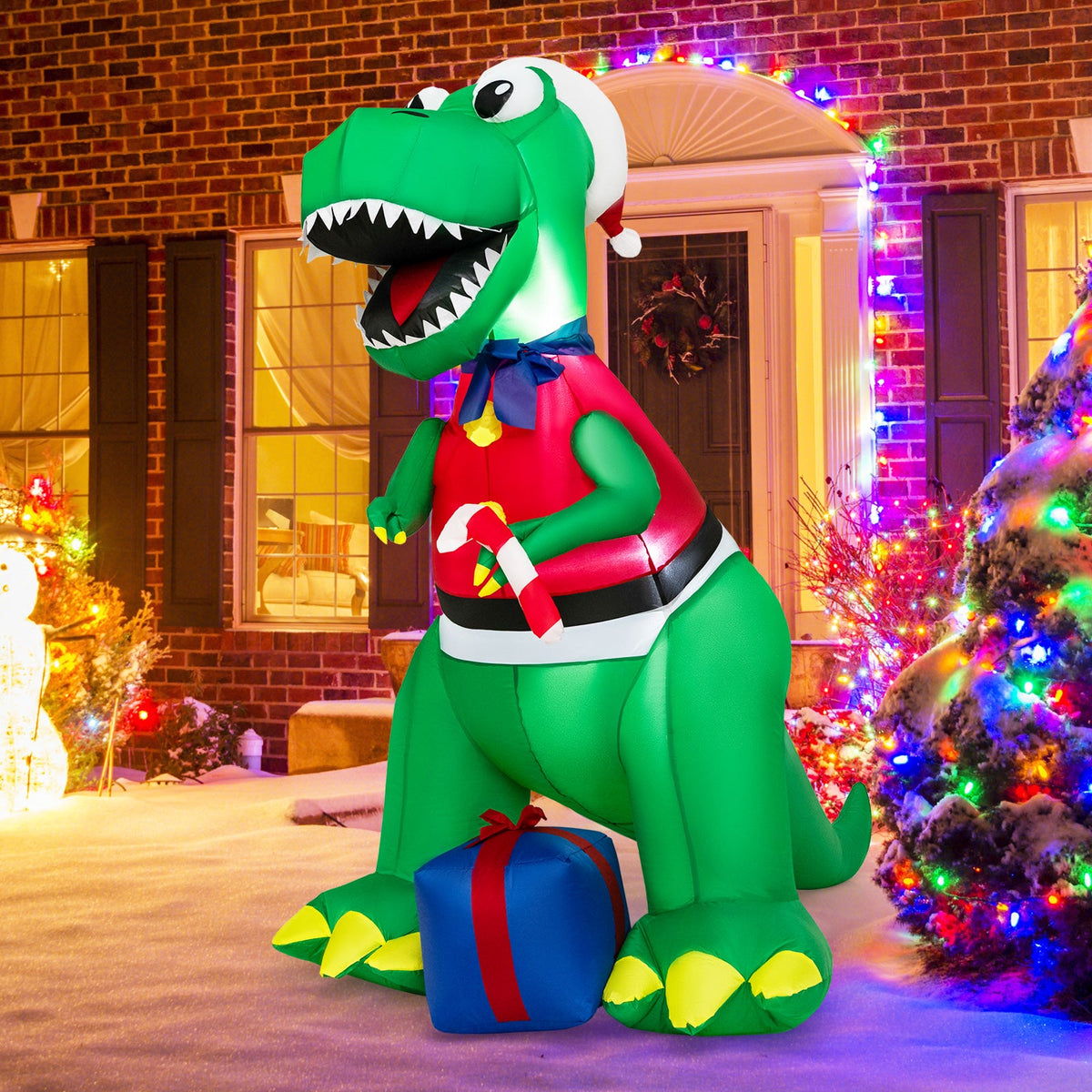 Inflatable Christmas dinosaur with LED lights, Santa hat, red scarf, blue gift at feet on Tampa Home & Garden Store