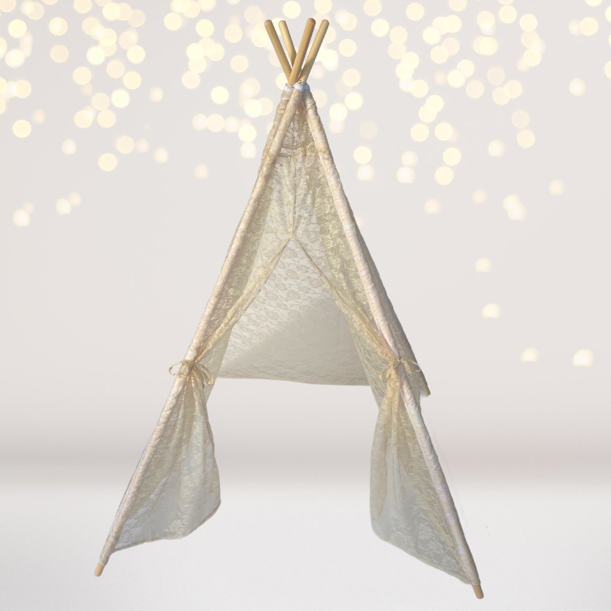 Dainty Lace Kids Teepee Tent in white and ivory lace with natural wooden poles on Tampa Home & Garden Store