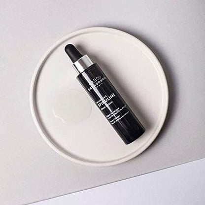 Face serum Institut Esthederm Intensive Spirulina bottle with dropper on white plate on Tampa Home & Garden Store