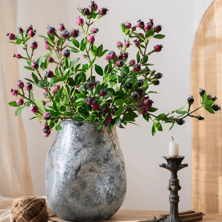 Alpine Blueberry stem by RusticReach with green leaves and purple berries in a silver vase on Tampa Home & Garden Store
