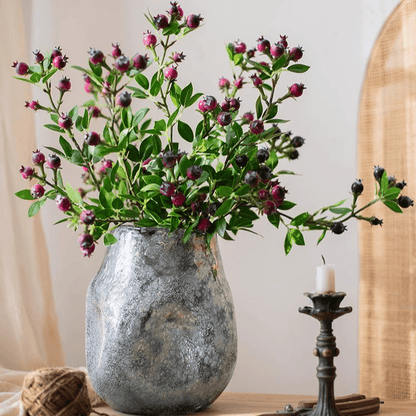 Alpine Blueberry stem by RusticReach with green leaves and purple berries in a silver vase on Tampa Home & Garden Store